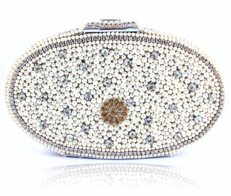 Vogue Crafts & Designs Pvt. Ltd. manufactures Divine Oval Pearl Clutch at wholesale price.